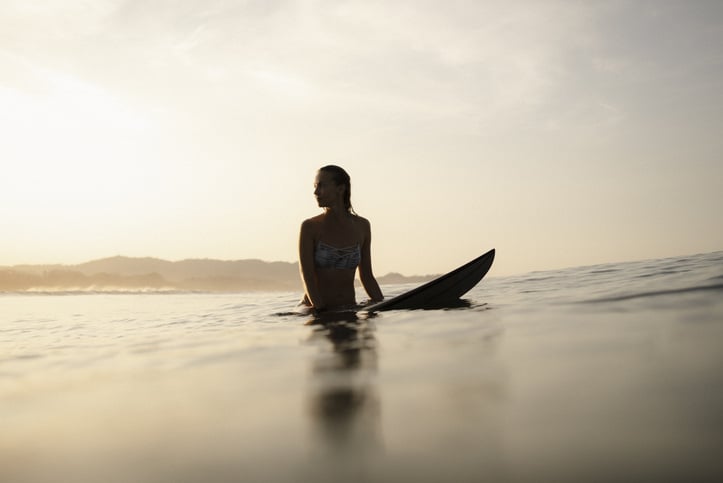 surfer looking at the horizon